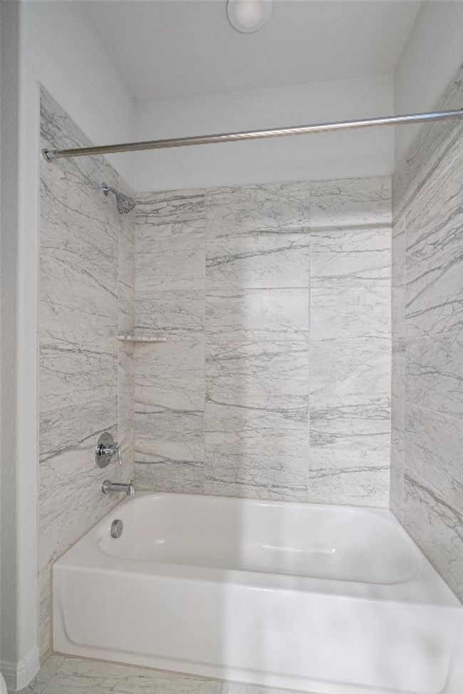 Bathroom featuring bathing tub / shower combination | Image 30