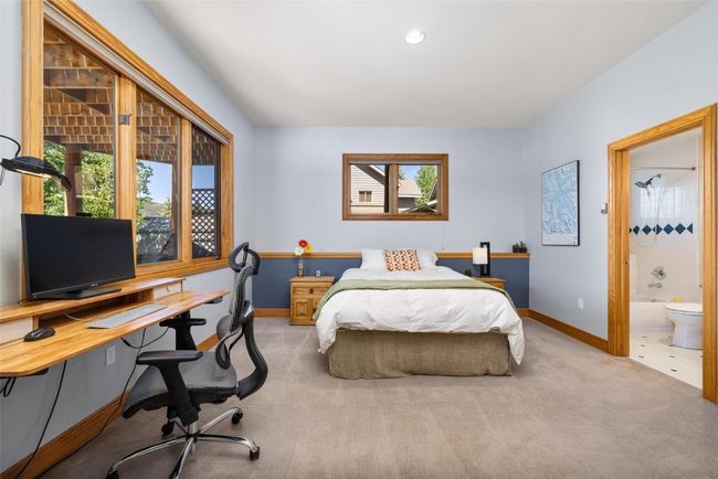 Carpeted bedroom featuring a desk, recessed lighting, and connected bathroom | Image 13