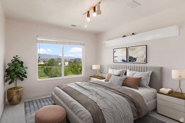 Carpeted bedroom featuring a mountain view, visible vents, and baseboards | Image 13