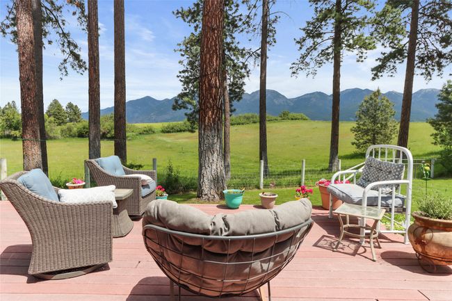 View of patio with a deck with mountain view and a view of countryside | Image 8