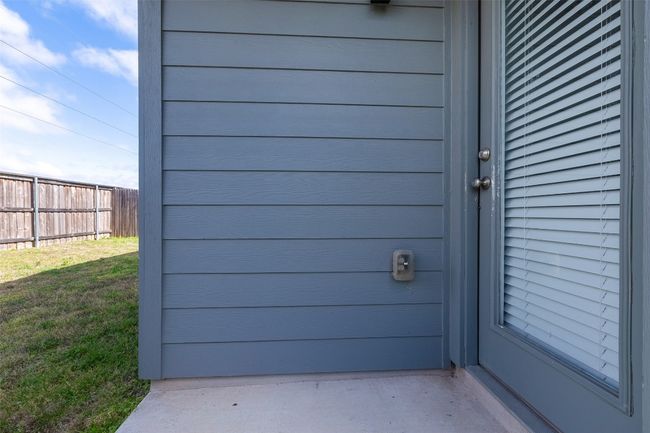 Property entrance featuring a yard and fence | Image 36