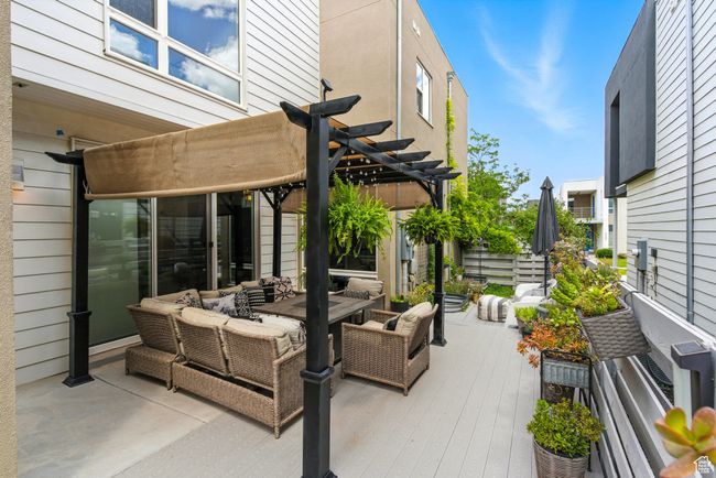 View of patio featuring a pergola, outdoor dining space, and an outdoor living space | Image 48