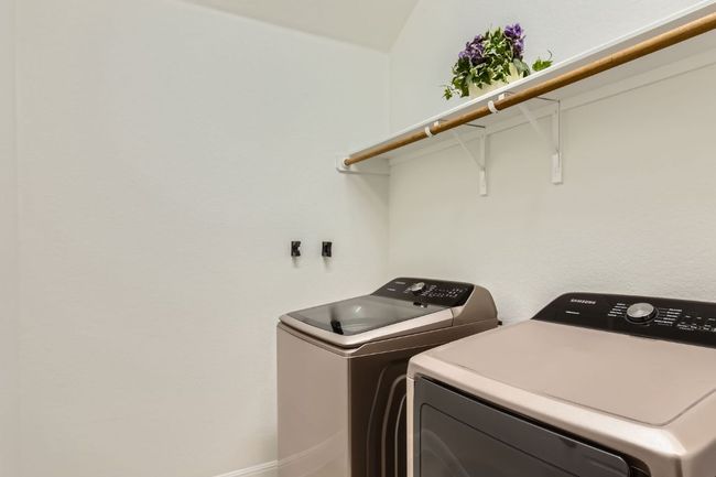 Laundry room with washing machine and dryer | Image 24