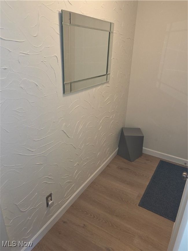 Unfurnished room featuring baseboards and wood finished floors | Image 30