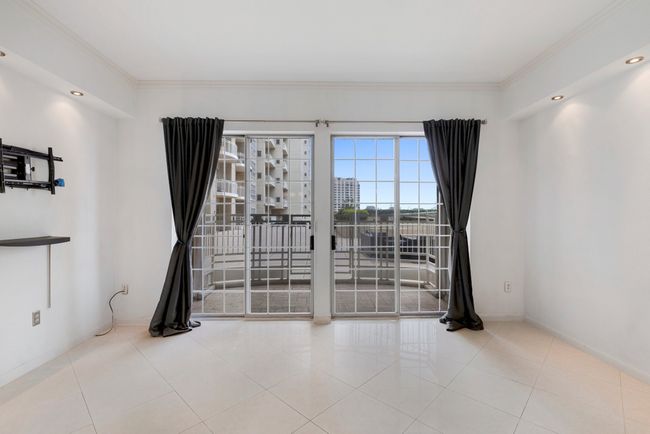 Private patio leads out to the pool and gym. | Image 9
