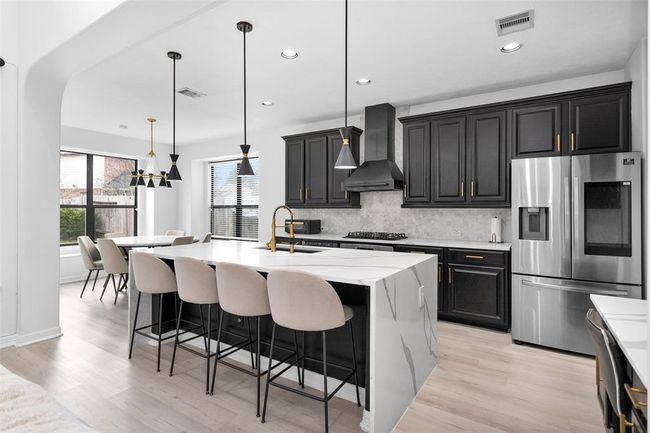 This updated kitchen is perfect for entertaining family and friends. | Image 13