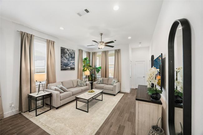 From this view, the home’s thoughtful design shines, an airy layout accented by high ceilings, recessed lighting, and picture windows that bring in warmth and brightness all day long. | Image 15