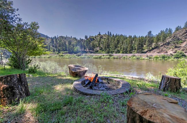 View of river featuring fire pit. | Image 53