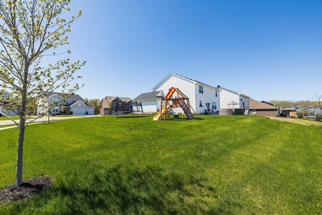 The large flat yard is perfect for play, pets, or future gardening dreams. | Image 43