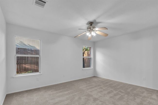 Unfurnished room featuring carpet and a ceiling fan | Image 17