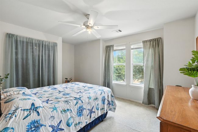 Bedroom featuring carpet flooring and ceiling fan | Image 21
