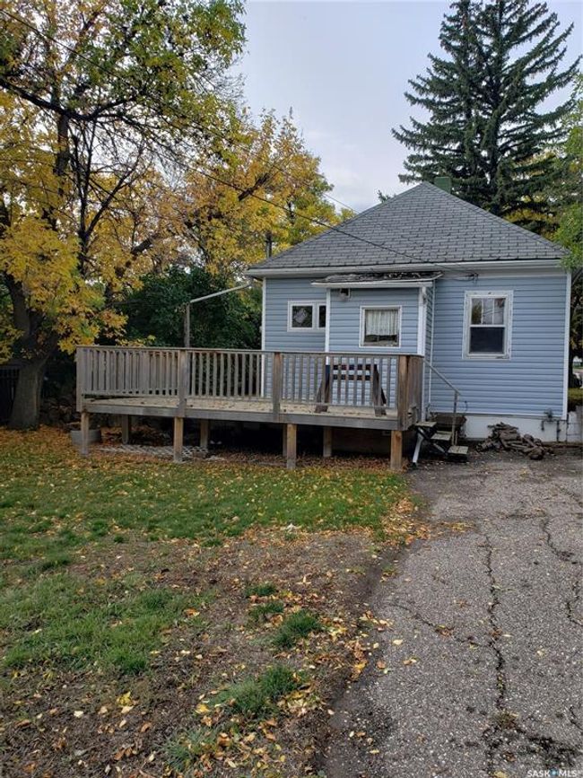 Large deck off the back door is very private with off street parking and a spacious yard | Image 28