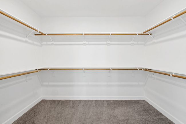 Walk in closet with carpet flooring | Image 24