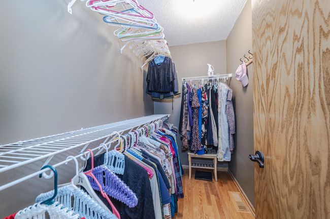 Large walk in primary bedroom closet! | Image 27