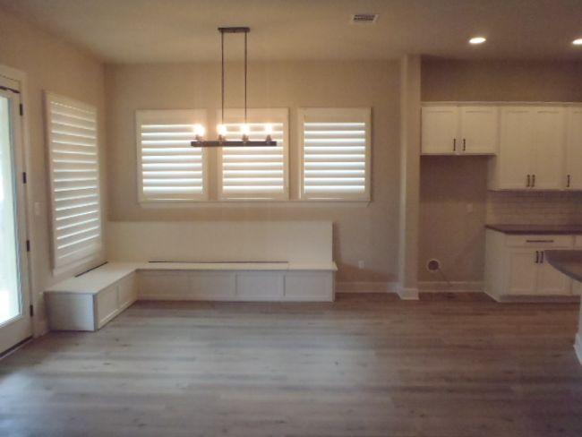 Unfurnished dining area with light wood-style flooring and recessed lighting | Image 17