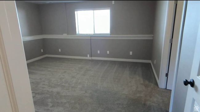 Carpeted empty room featuring baseboards | Image 51