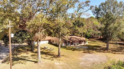 experience country living in this 5 acre home. | Image 1