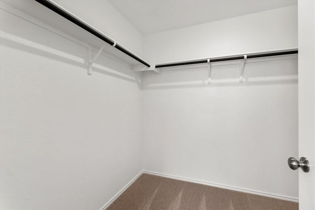 Walk in closet featuring carpet floors | Image 17