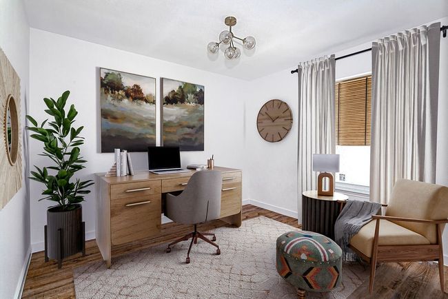 Office space with baseboards, light wood-style floors, and a chandelier | Image 6