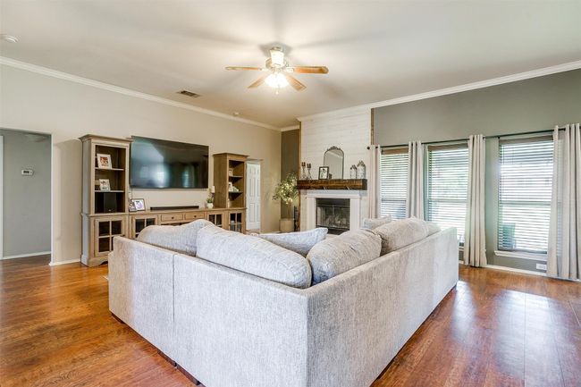 Living room featuring a fireplace. | Image 12