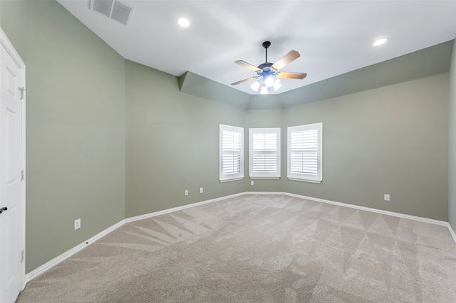 Carpeted spare room with ceiling fan, baseboards, and recessed lighting | Image 20