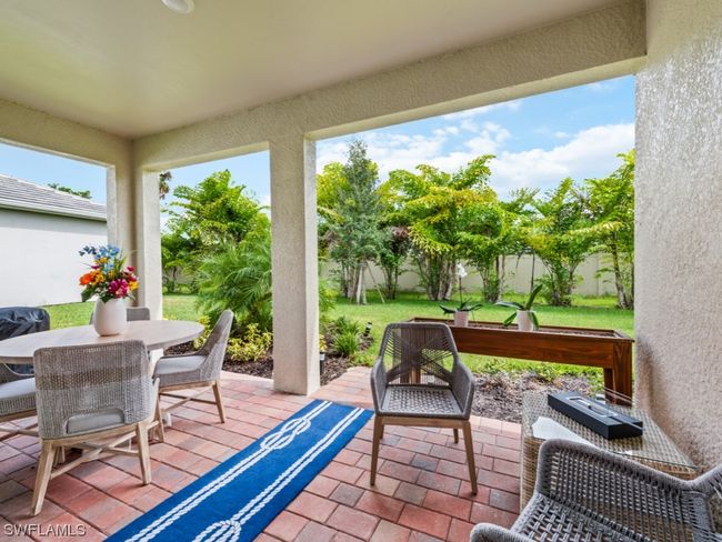 Step onto the rear lanai into the large covered area of your outdoor oasis with ample space for a future pool/spa, promising endless relaxation and fun! | Image 10