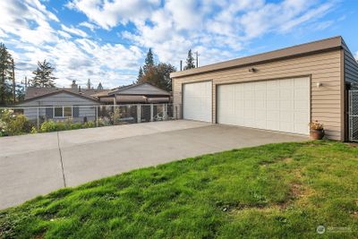 3-car detached plus 1-car attached garage & huge fenced driveway! | Image 2