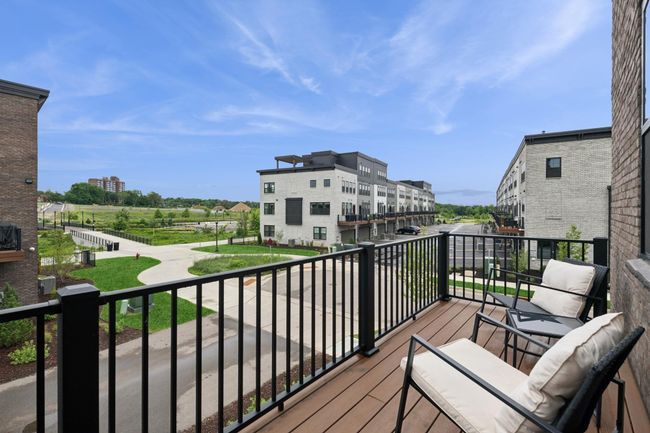 Deck/patio off the main level offers the perfect spot to chill and grill—enjoy great views as you relax and unwind outdoors. | Image 10
