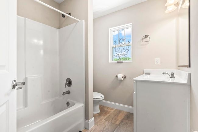 Bonus room with lofted ceiling, carpet floors, and a ceiling fan | Image 28