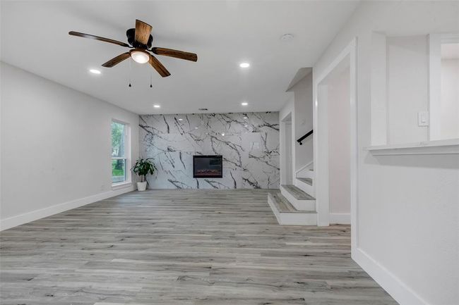 Spectacular living room with a lovely electric fireplace for the cold winter days. | Image 10