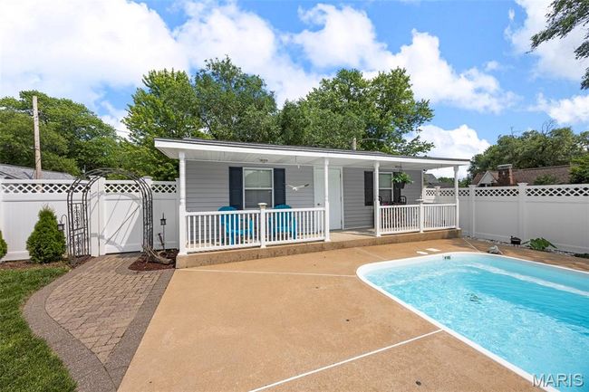 View of pool with a gate and a porch | Image 36
