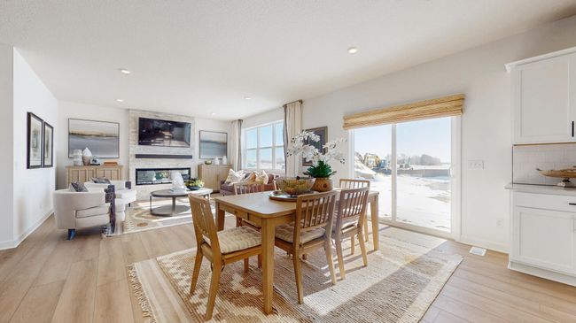 (Photo of a model home, actual features may vary) Soaked in natural sunlight, the homes eat-in dining room has ample room for a dining table located in the heart of the home. | Image 5