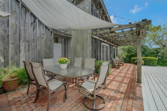 View of patio / terrace with a pergola and outdoor dining area | Image 17