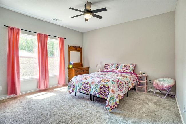 Bedroom featuring carpet and ceiling fan | Image 29