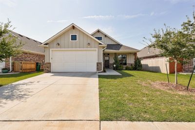 View of front of property with a garage and a front yard | Image 2