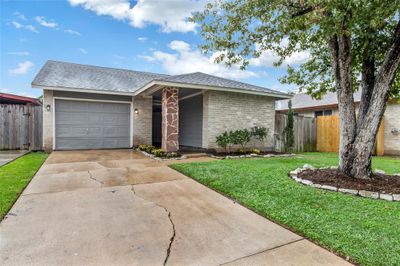 Welcome to this cozy 3 bed 2 bath home in Bear Creek Cypress. Featuring a single-car garage and freshly pressure-washed driveway | Image 1