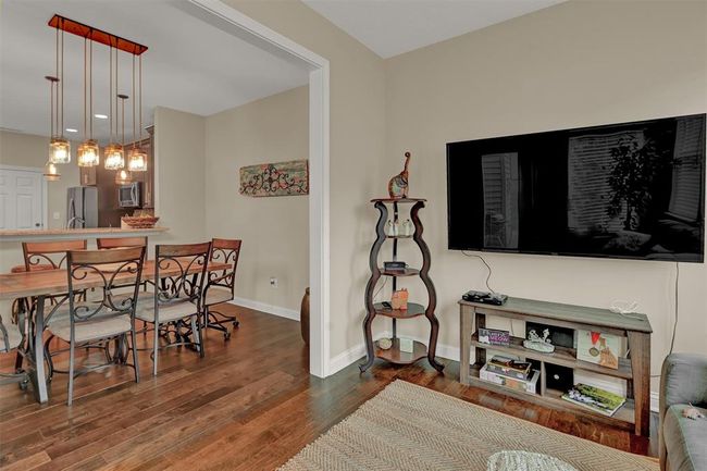 EATING AREA BLENDS INTO THE SUN ROOM - GREAT OPEN MAIN LEVEL! | Image 10