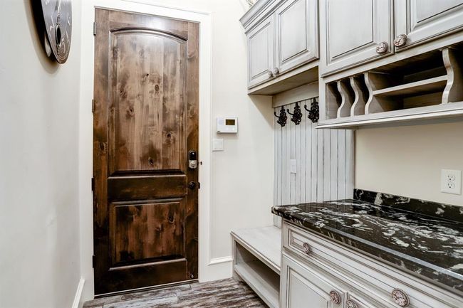Mudroom with entry to the 4 car garage. | Image 29