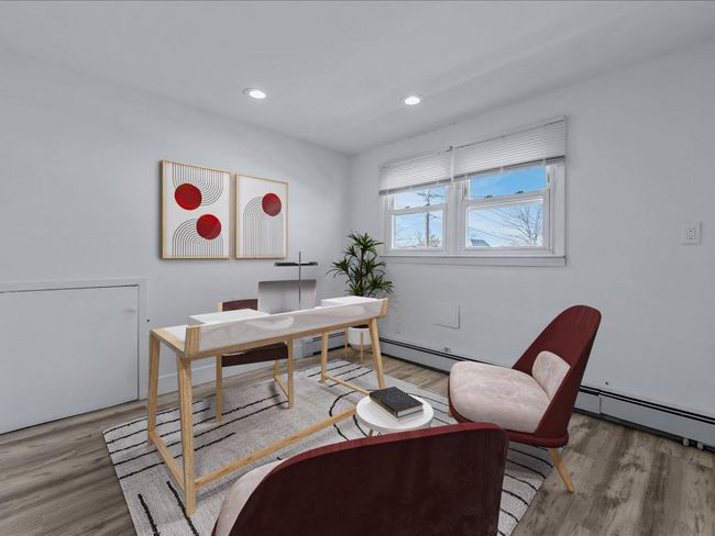 Office space featuring wood finished floors, recessed lighting, and a baseboard radiator | Image 18