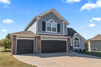 View of front of house with a garage | Image 2