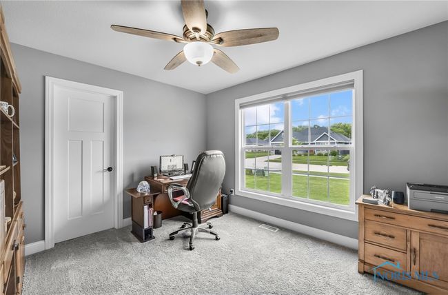 Bedroom #3. An additional guest bedroom, a craft room or like it is currently used as a home office. | Image 17