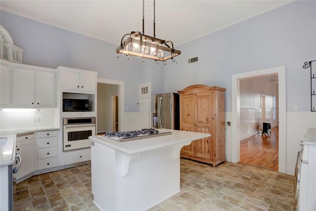 KITCHEN WITH DINING ROOM TO LEFT AND GREAT ROOM & REAR FOYAR EXIT TO THE RIGHT. G.E. SIDE BY SIDE FRIDGE. NEW G.E. DISHWASHER | Image 9