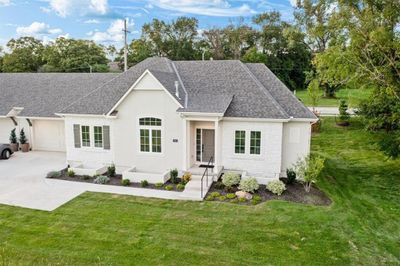 Front exterior. Not shown on right side of home is screened porch. This pic was taken prior to units being built opposite this one. | Image 3