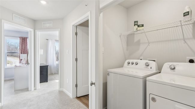 Upstairs laundry room is the epitome of convenience | Image 21