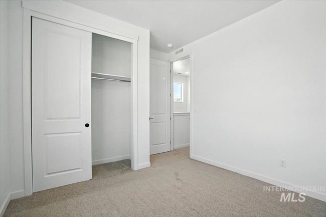 Unfurnished bedroom featuring carpet flooring and a closet | Image 14