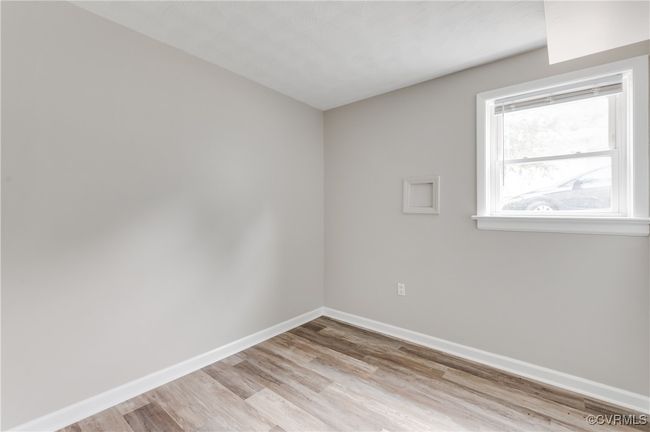 Spare room featuring light wood finished floors | Image 23