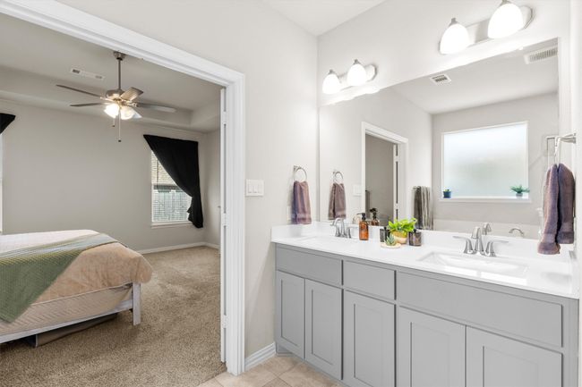 Bathroom with double vanity, a ceiling fan, connected bathroom, and tile patterned flooring | Image 19
