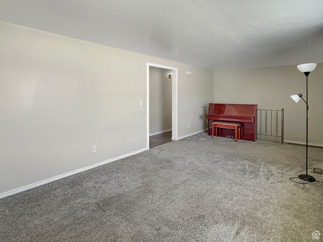 Carpeted living area with baseboards | Image 13