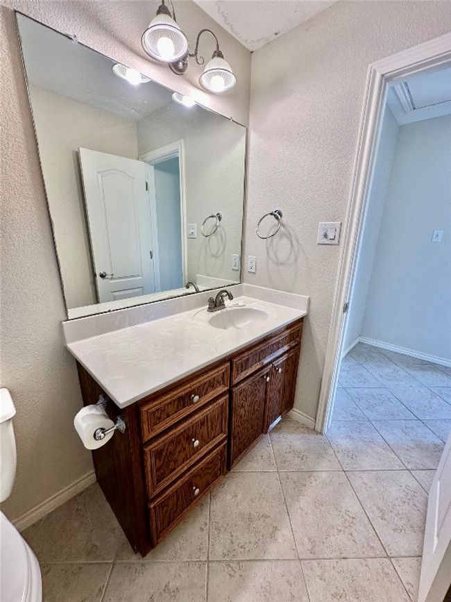 Bathroom featuring vanity and tile patterned floors | Image 18