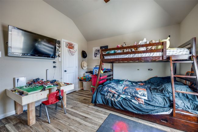 Bedroom with lofted ceiling and wood-type flooring | Image 18